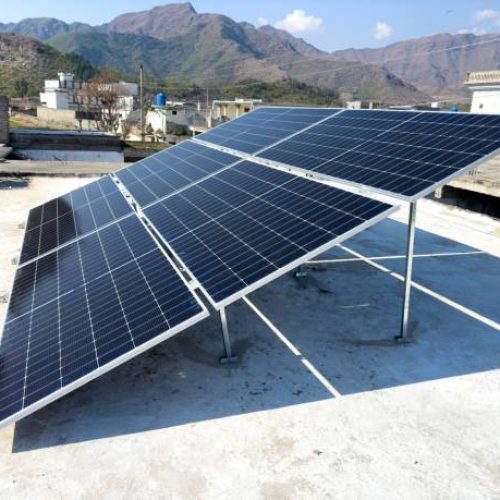 istockphoto-1997877918-612×612 Solar panels on a house roof in Pakistan by generating clean and renewable energy.